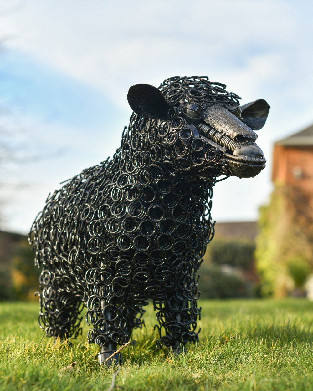 Rustic Black Sheep Bed Spring Garden Sculpture