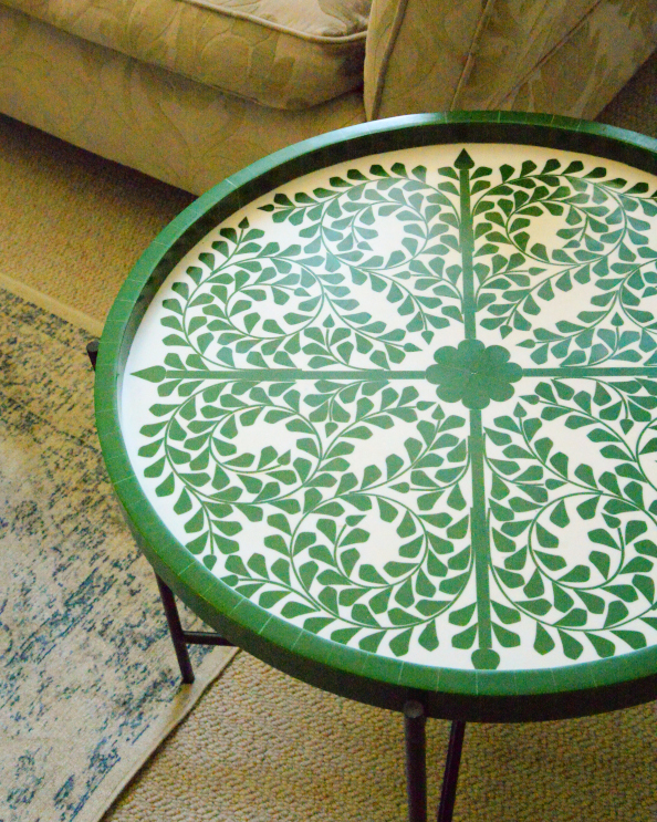 Close Up Of The Circular Decorative Wooden Table With Iron Legs - Green