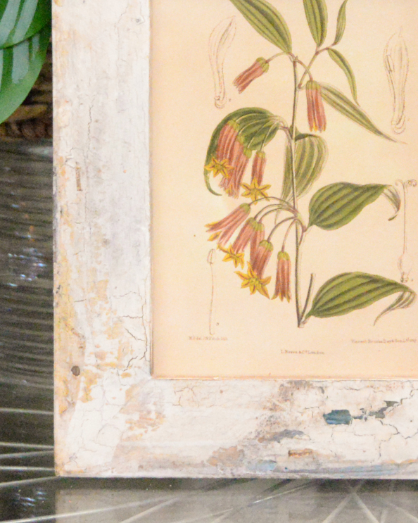 Close Up Of The Recycled Wooden Framed Floral Artwork
