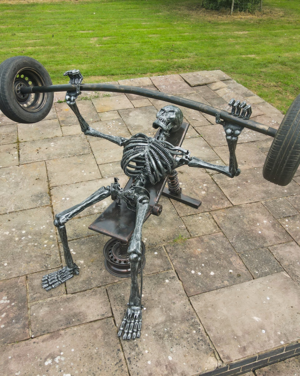 Recycled Metal Bench Pressing Skeleton Sculpture - 'Exploiting Our Inscurit…