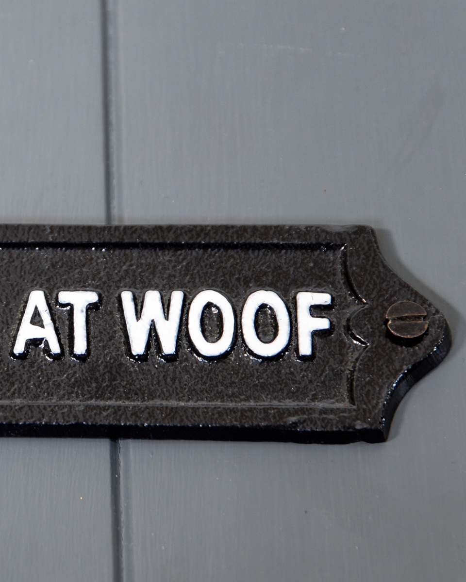 Close Up of The Fixings on The Cast Iron 'Had Me At Woof' Humour Sign